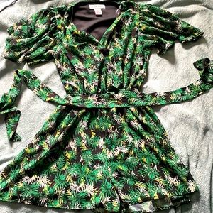 Plant printed romper with flowy sleeves and deep V neck